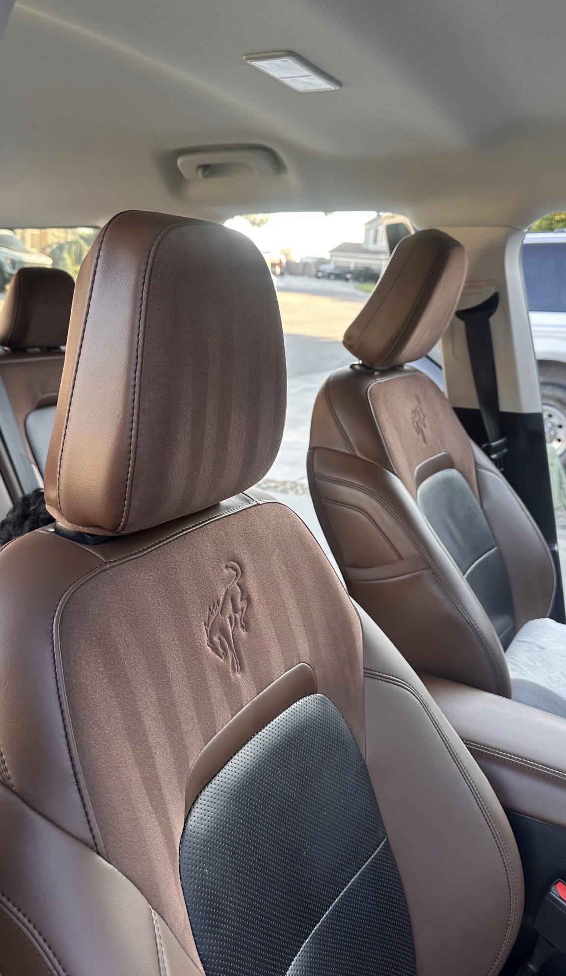 Brown suede Ford Bronco seats after interior detail