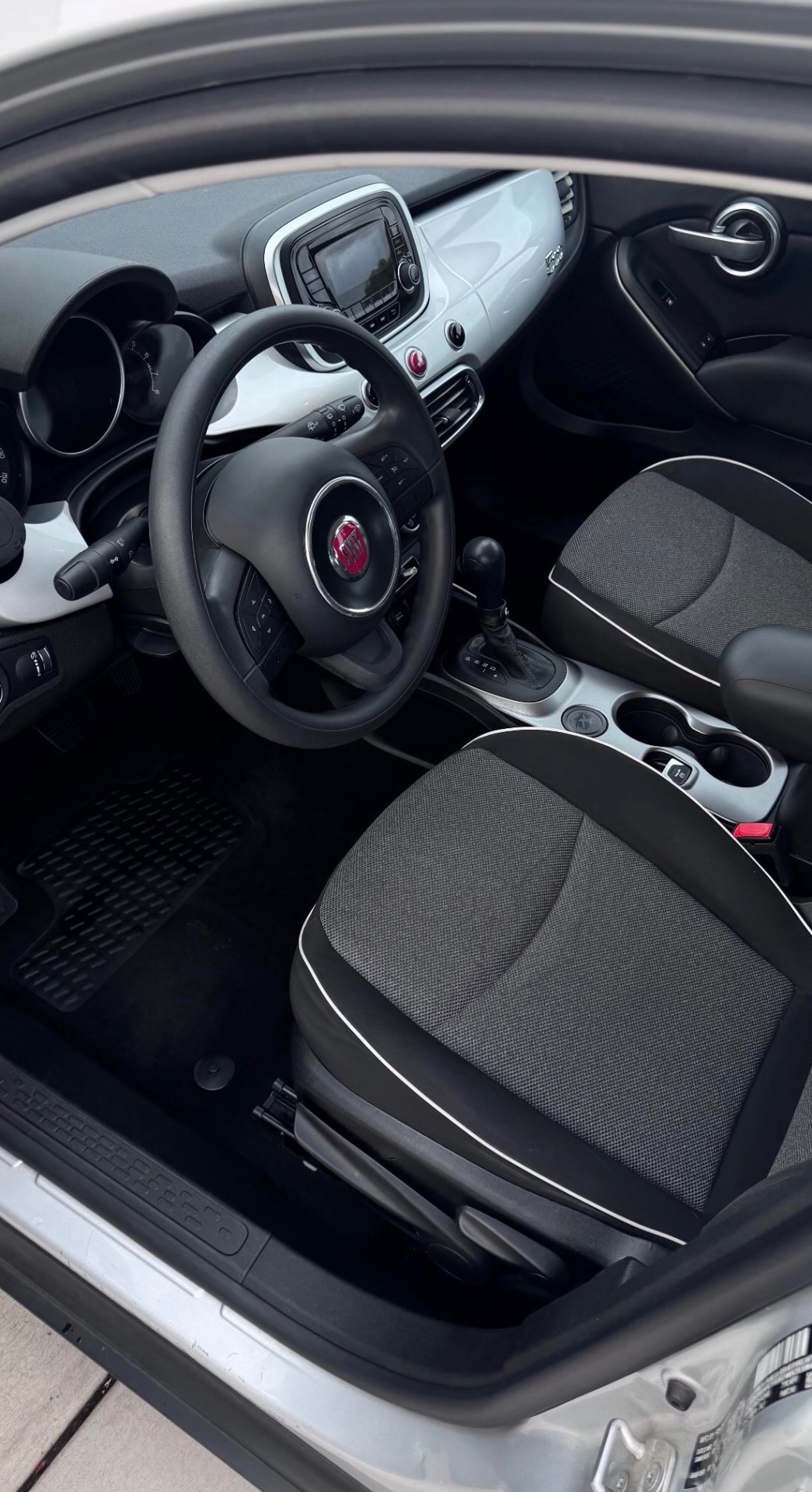 Cleaned cloth seats and dash of a Fiat 500X